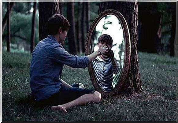 boy looking in the mirror