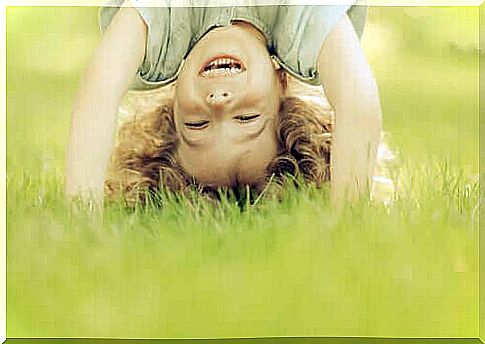 boy playing in the grass