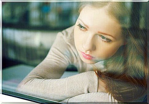 woman-feeling-guilty-looking-out-the-window