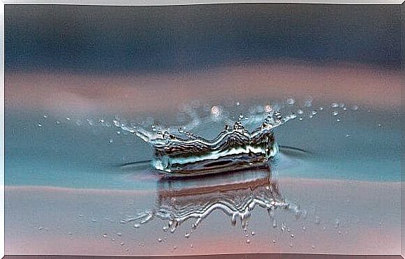 Drop of water hitting surface