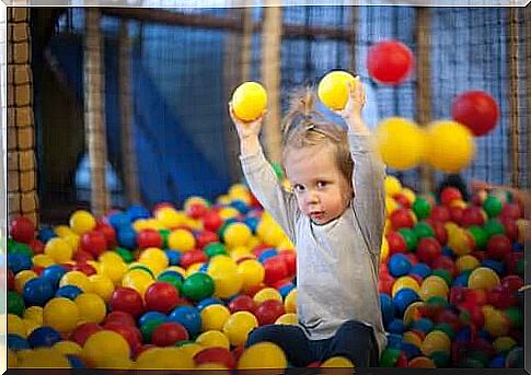 child in ball pool