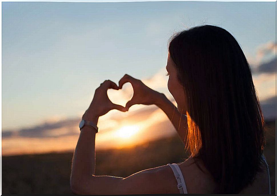 woman making heart with her hand