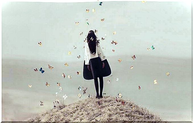 young woman surrounded by butterflies