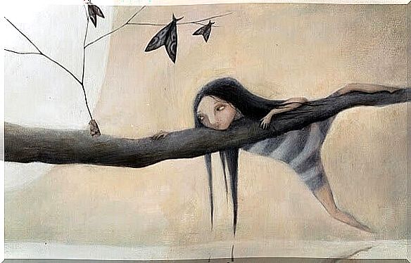 girl hanging from a tree branch